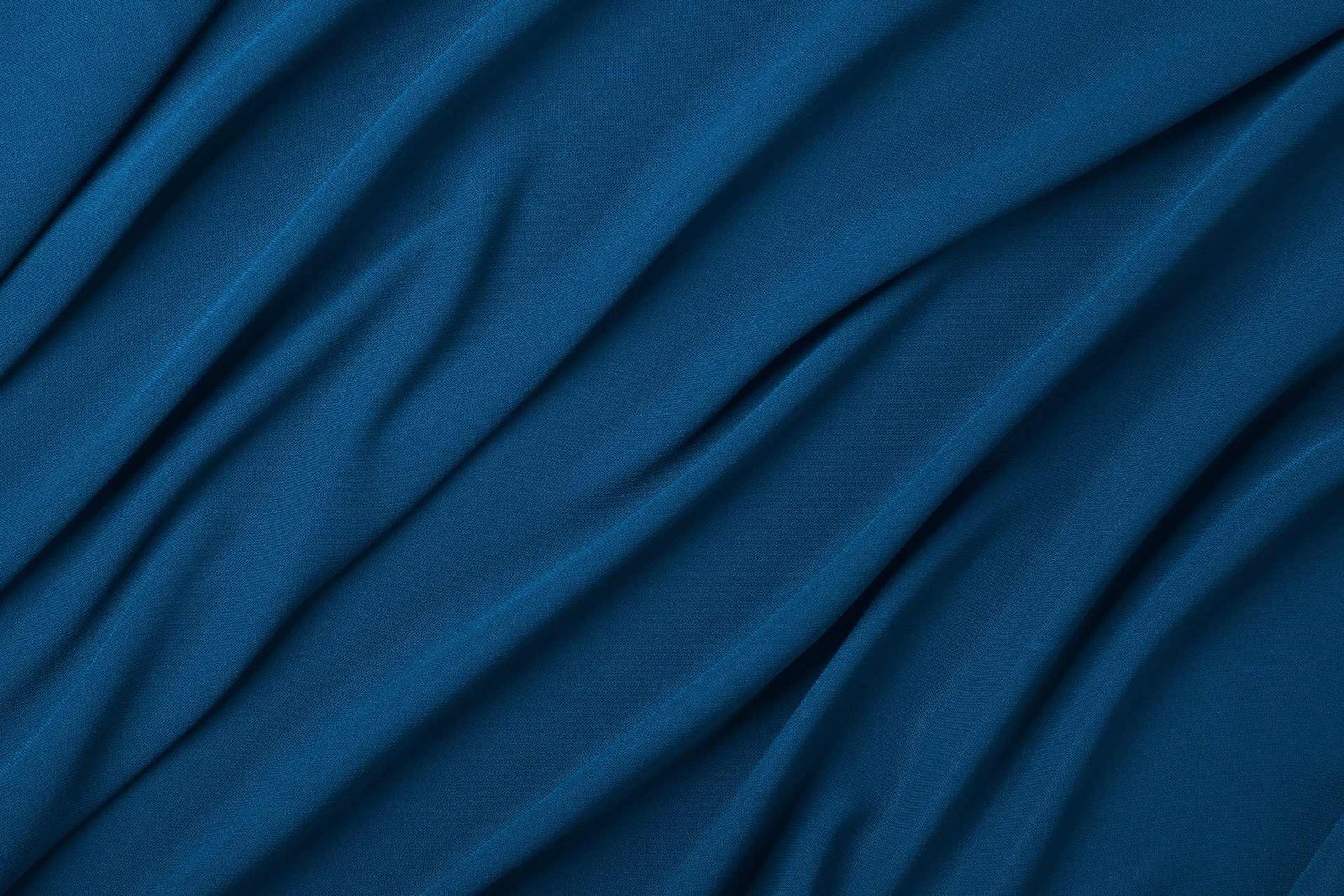 background-of-blue-textile-folded-pleats-J92QJH8a.jpg Custom Apparel with Customise Clothing
